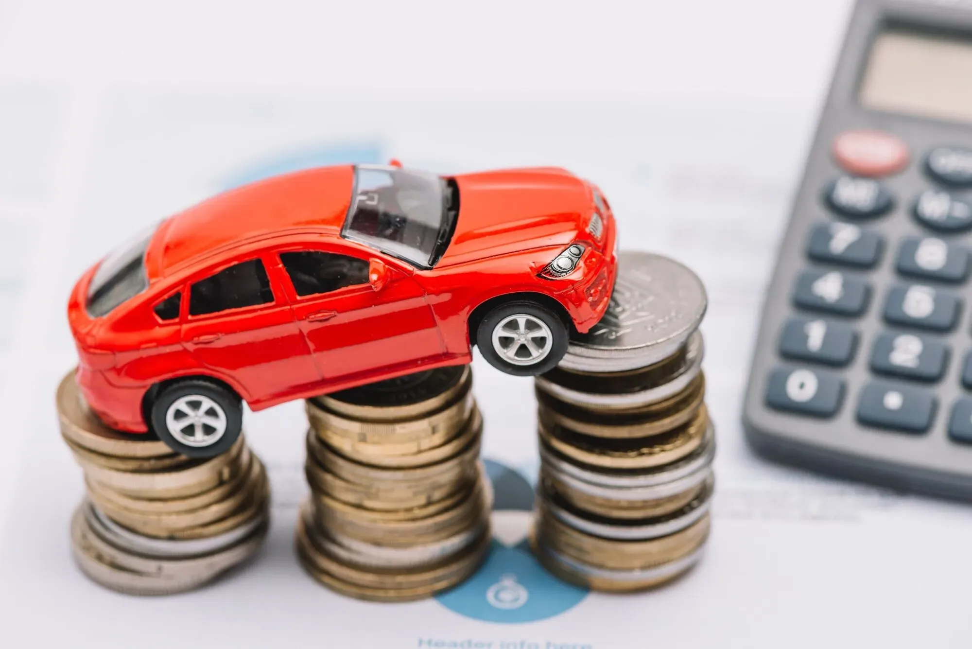 toy-car-balancing-increasing-coin-stack-2.webp